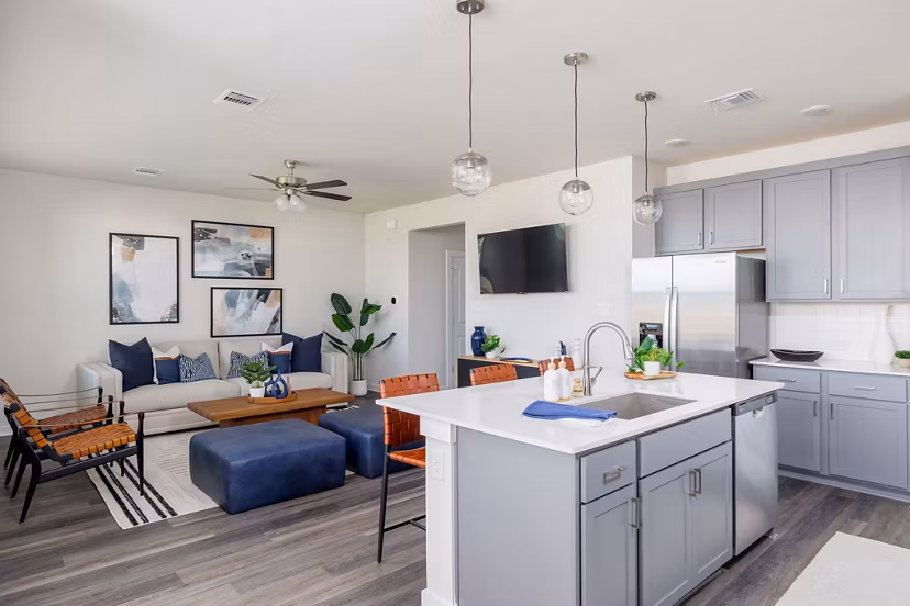 Modern kitchen with stainless steel appliances in Caso University Heights Apartments
