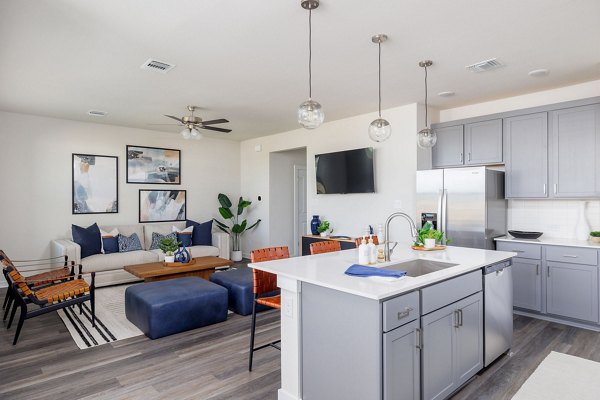 Modern kitchen with stainless steel appliances in Caso University Heights Apartments