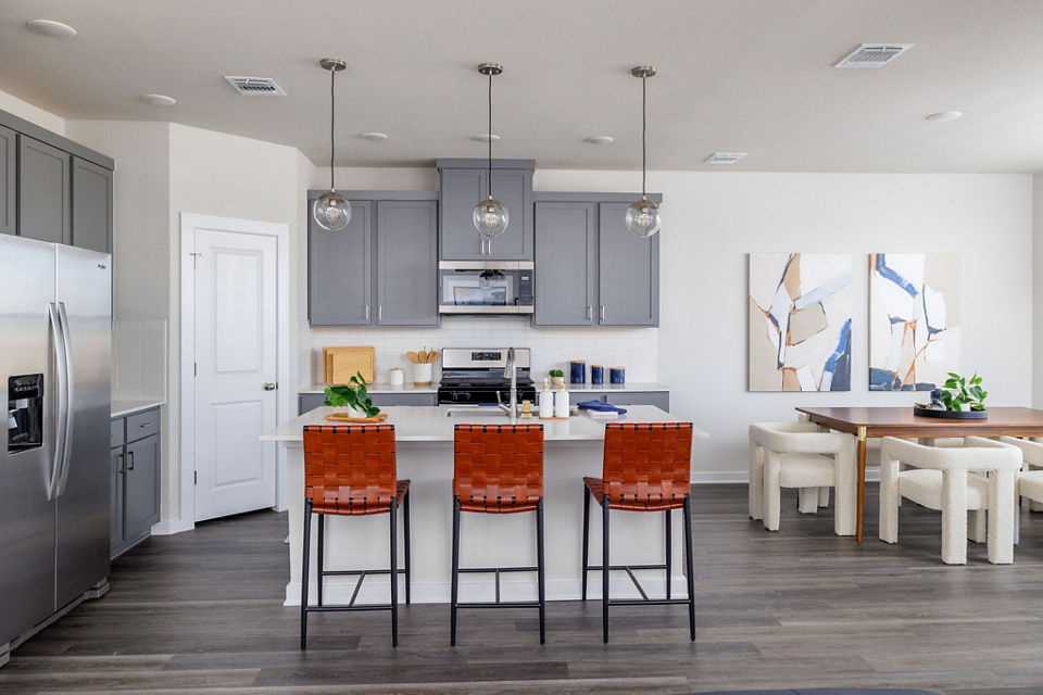 Modern kitchen with stainless steel appliances in Caso University Heights Apartments