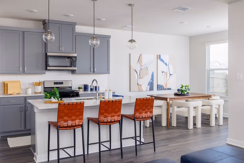 Kitchen showcasing sleek counters and modern appliances in Caso University Heights Apartments
