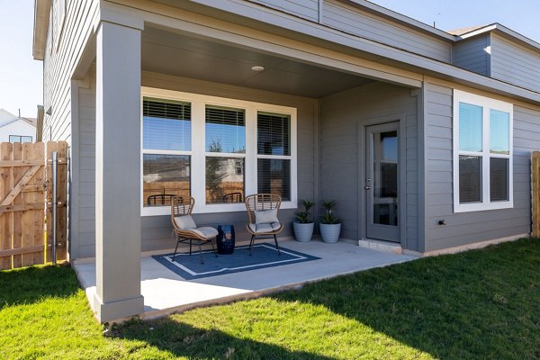 Scenic patio with outdoor seating at Caso University Heights Apartments, ideal for relaxation and gatherings in a vibrant community setting