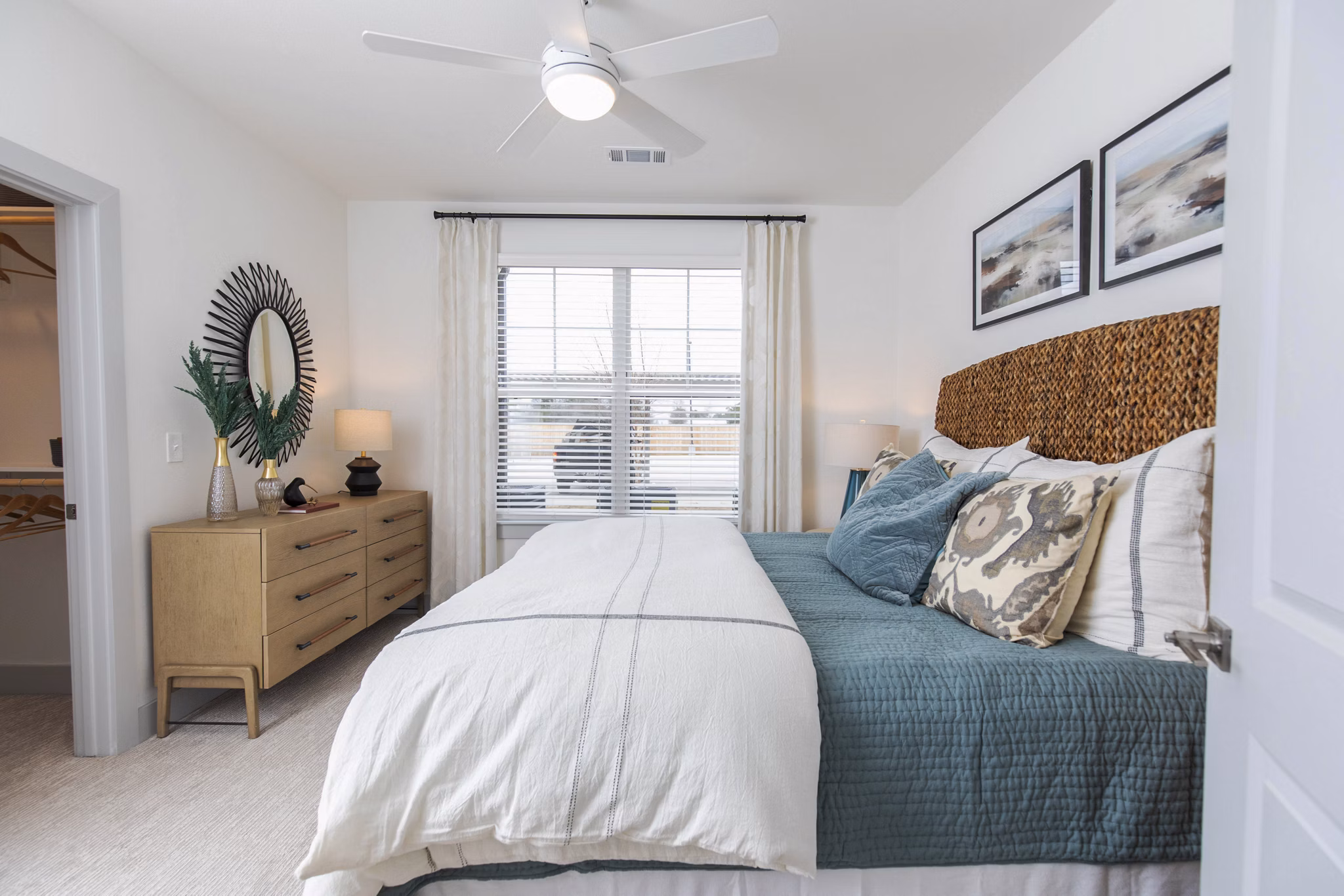 Cozy bedroom with modern decor at The Madison at City Place Apartments