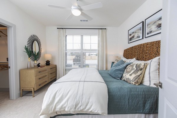 Cozy bedroom with modern decor at The Madison at City Place Apartments
