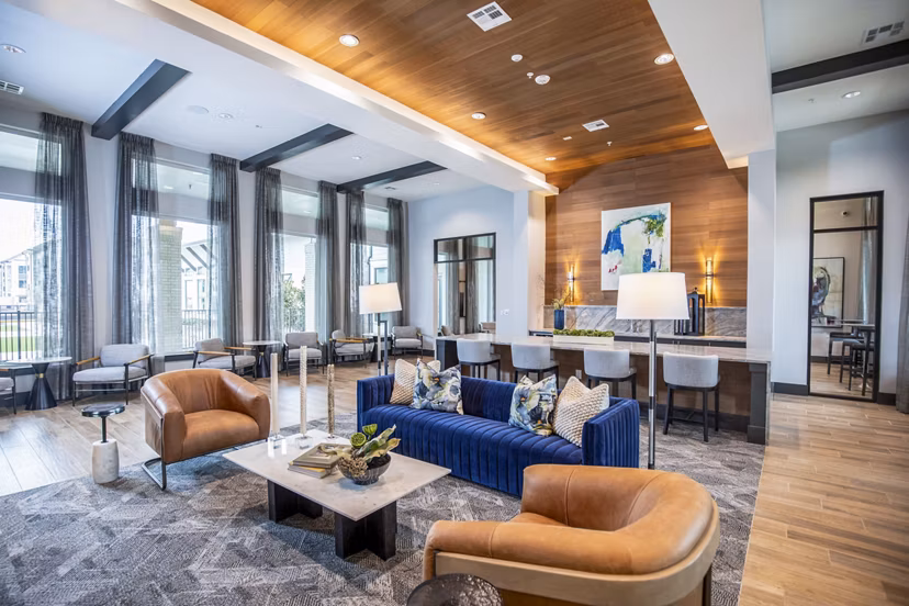 Clubhouse featuring modern design and comfortable seating at The Madison at City Place Apartments, offering a luxurious community space