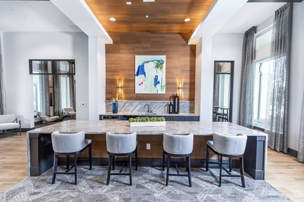Clubhouse with modern seating and entertainment options at The Madison at City Place Apartments, luxury living experience