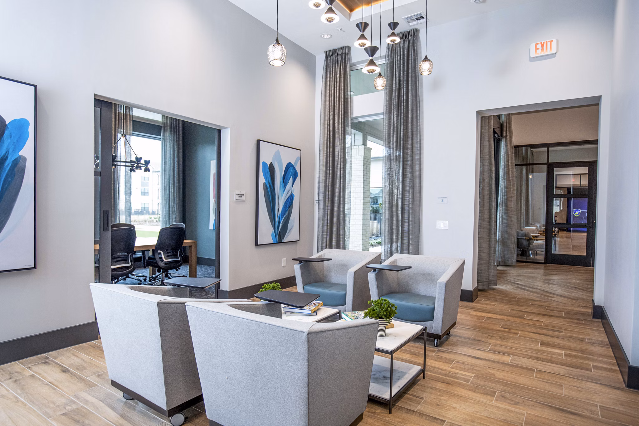 Clubhouse business center with modern workstations at The Madison at City Place Apartments, offering luxury meeting spaces for residents