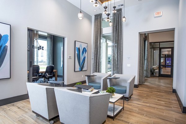 Clubhouse business center with modern workstations at The Madison at City Place Apartments, offering luxury meeting spaces for residents
