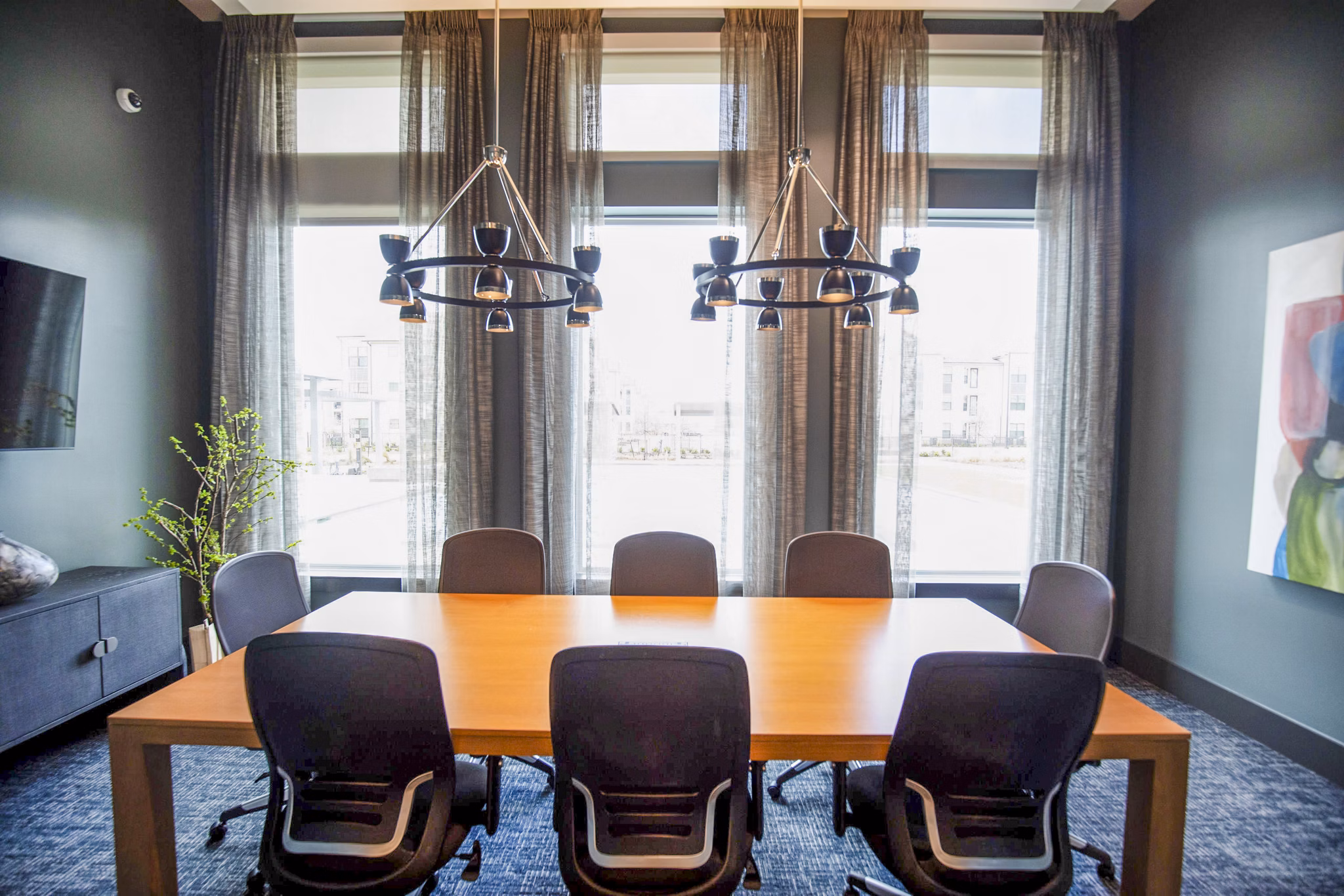 Clubhouse meeting facility with modern furnishings at The Madison at City Place Apartments