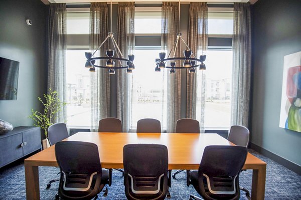 Clubhouse meeting facility with modern furnishings at The Madison at City Place Apartments