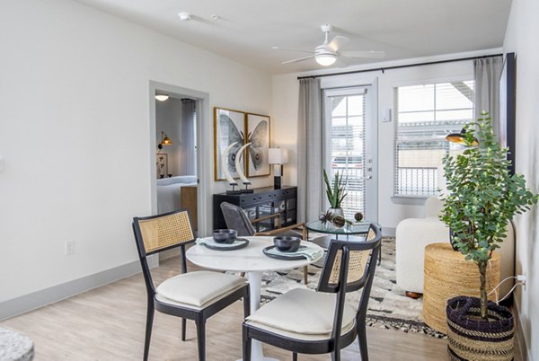 Dining room featuring elegant lighting and modern decor in The Madison at City Place Apartments Perfect for stylish dining experiences