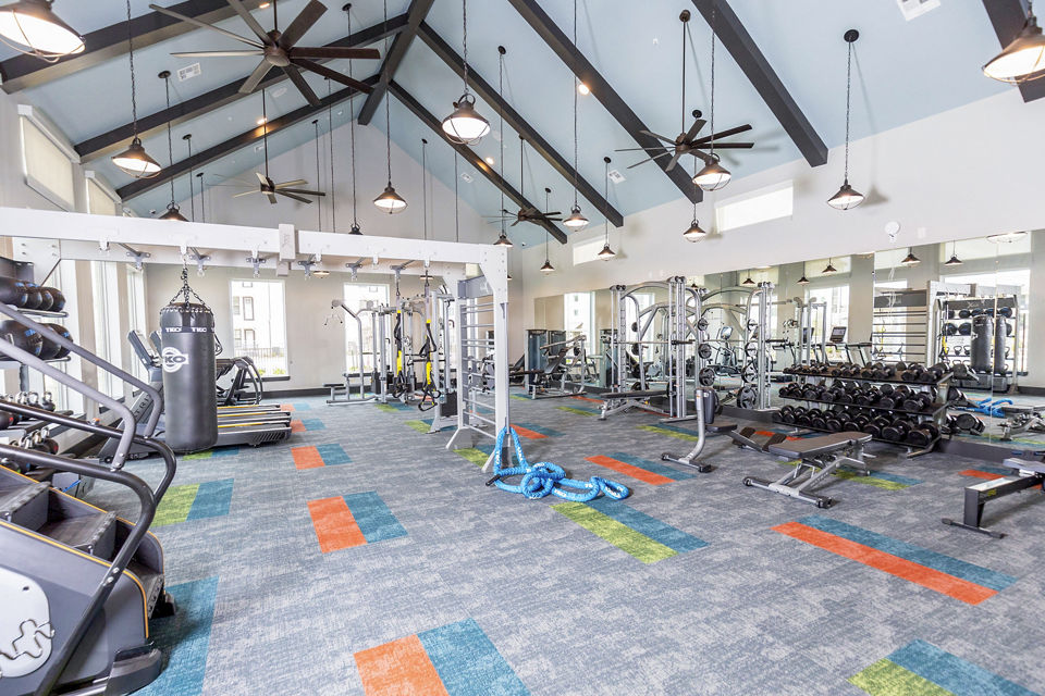 Modern fitness center with state-of-the-art equipment at The Madison at City Place Apartments