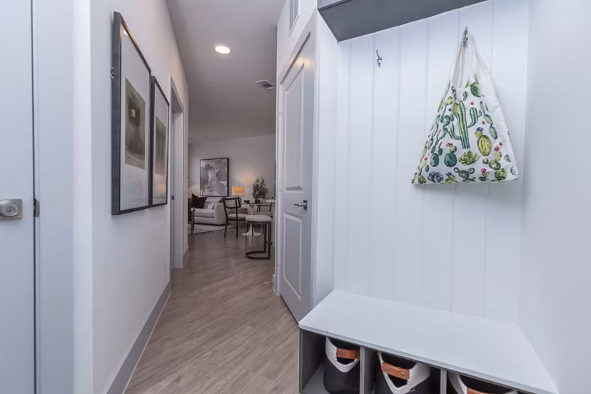 Hallway entrance featuring contemporary design and modern lighting at The Madison at City Place Apartments