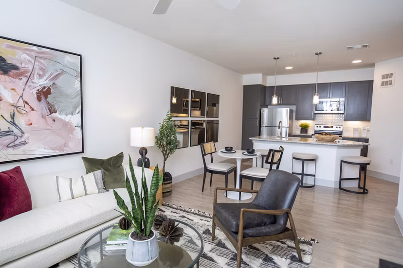 Spacious living room with modern decor in The Madison at City Place Apartments
