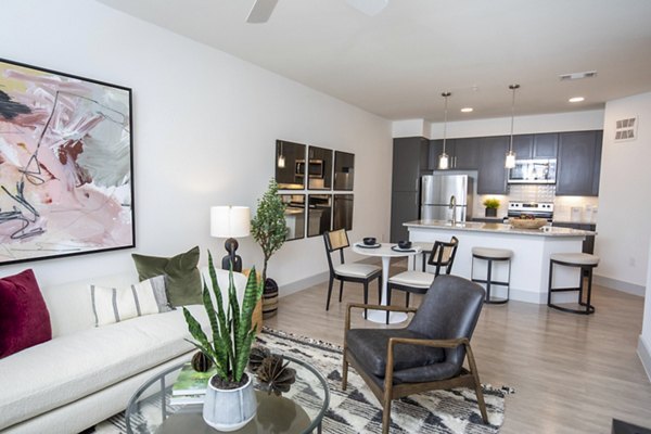Spacious living room with modern decor in The Madison at City Place Apartments