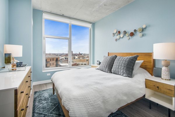 Modern bedroom with cozy furnishings at Spoke Apartments offers comfort and style