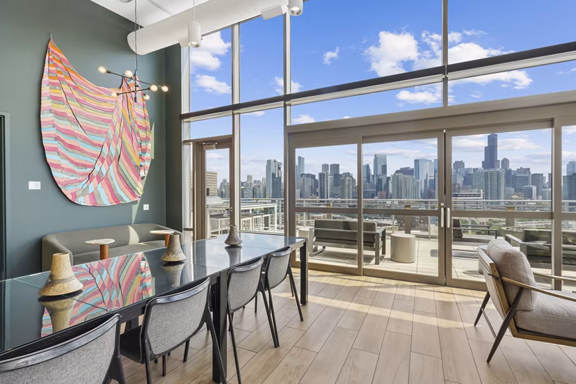 Clubhouse kitchen with modern appliances and seating area at Spoke Apartments, offering luxury amenities for residents