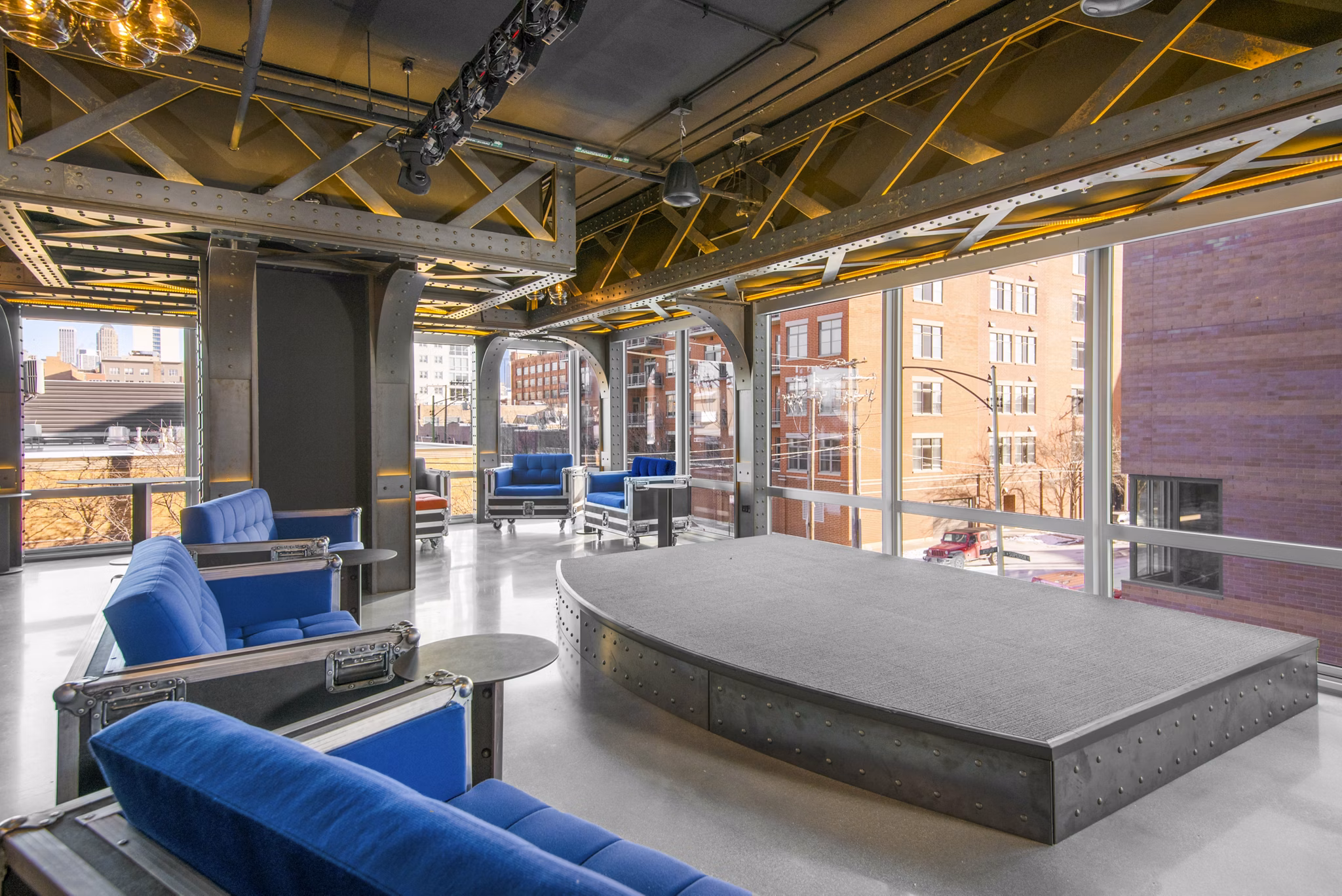 Clubhouse stage featuring modern lighting at Spoke Apartments, ideal for events and gatherings