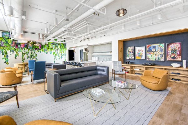 Clubhouse featuring modern seating and entertainment area at Spoke Apartments