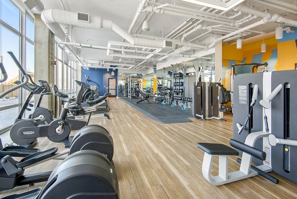 Modern fitness center with state-of-the-art equipment at Spoke Apartments