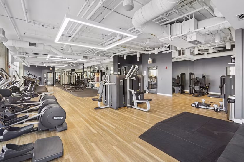 Modern spin studio with state-of-the-art bikes at Spoke Apartments offering luxury fitness amenities