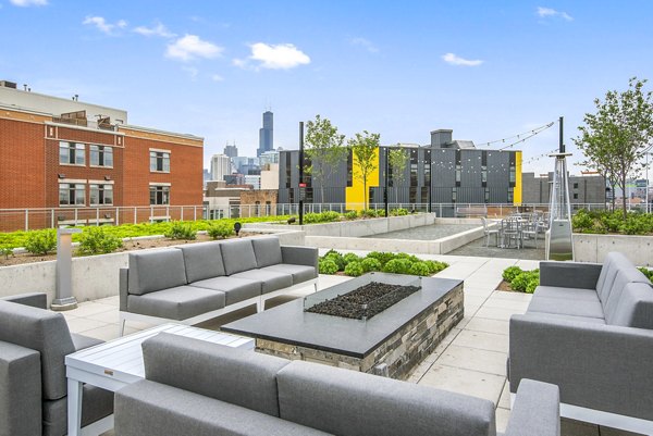 Cozy fire pit on a spacious patio at Harvest Apartments