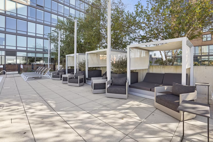 Outdoor grill area and patio at Harvest Apartments, perfect for social gatherings and relaxation in luxury surroundings