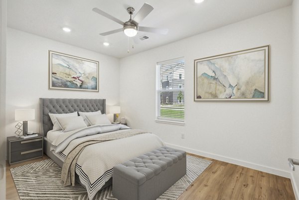 Cozy bedroom featuring modern furnishings at Bell's Lake Apartments, part of Greystar's luxury apartment offerings