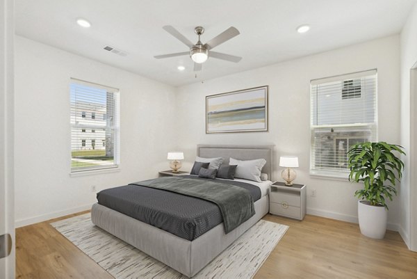 Spacious bedroom with modern decor at Bell's Lake Apartments