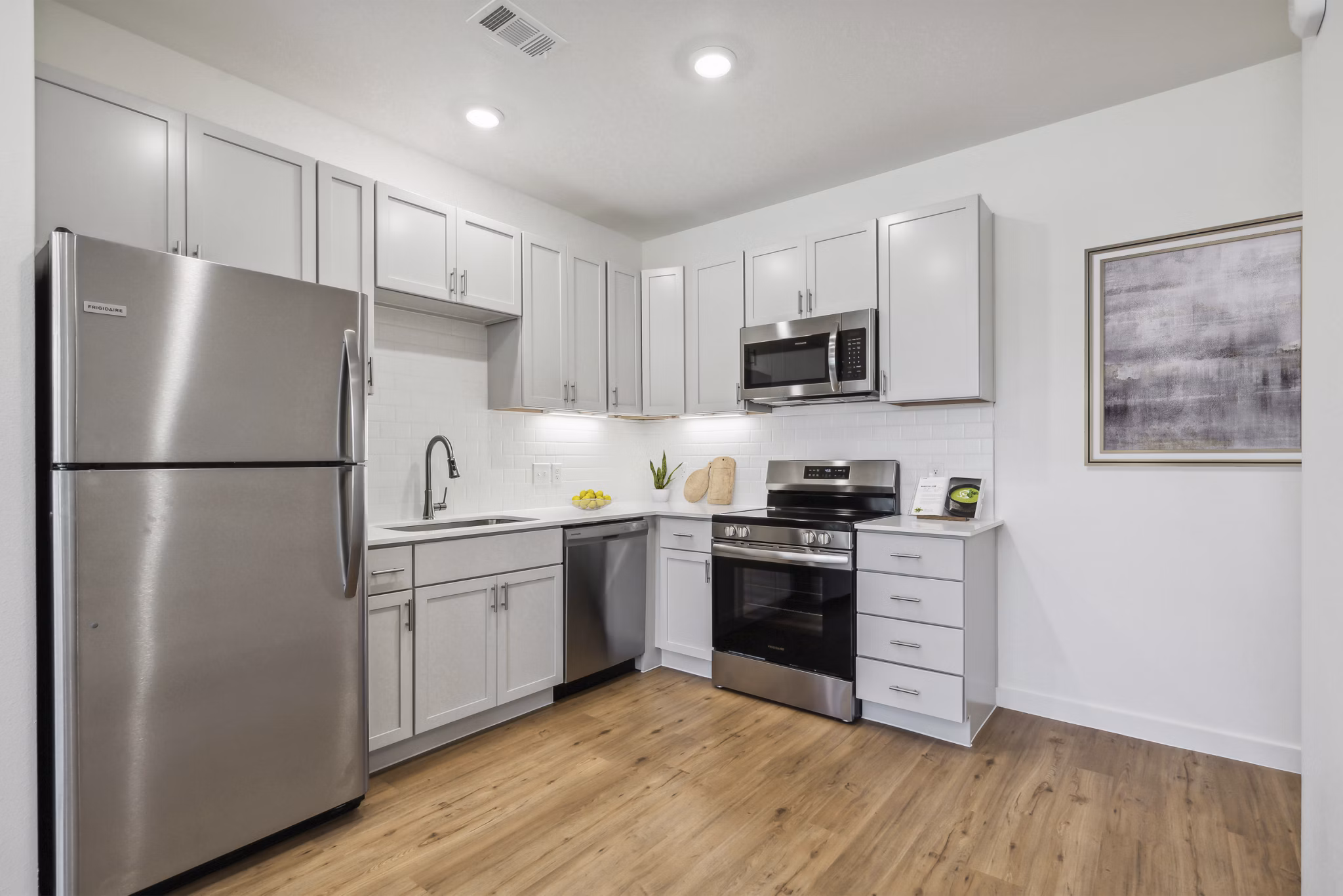 Modern kitchen featuring stainless steel appliances at Pure OKC Apartments
