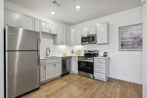 Modern kitchen featuring stainless steel appliances at Pure OKC Apartments