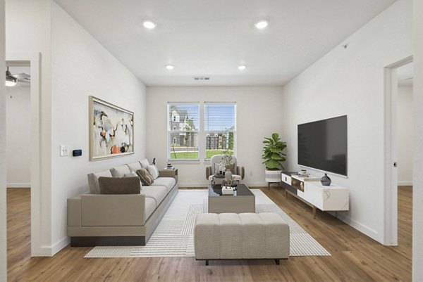 Modern living room with sleek furnishings and large windows at Pure OKC Apartments