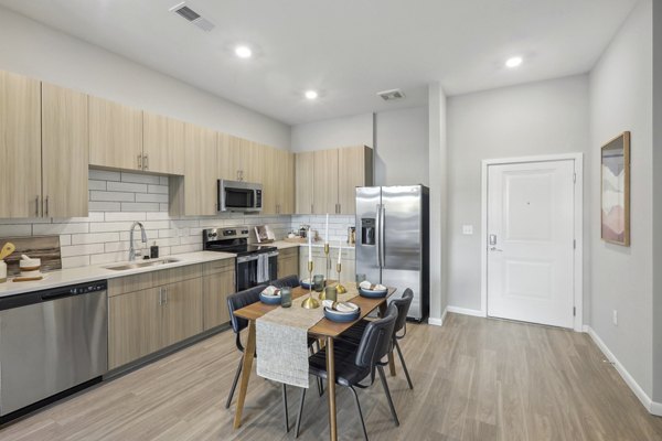 Modern kitchen with stainless steel appliances at Innsbrook Square Apartments