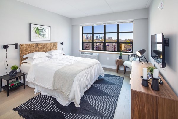Modern bedroom with stylish decor at Embankment House Apartments, Greystar luxury property