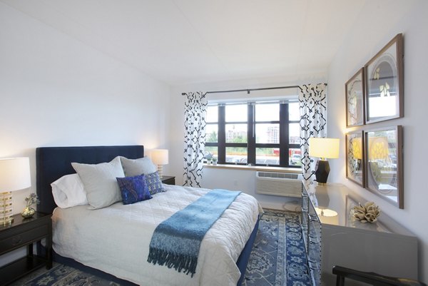 Luxurious bedroom with modern dÃ©cor at Embankment House Apartments in a Greystar luxury community