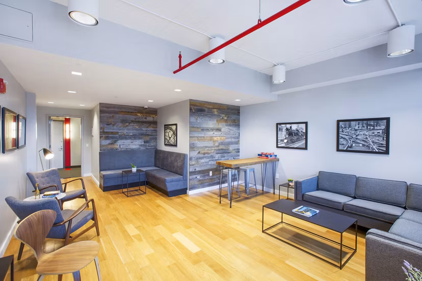Modern clubhouse with elegant seating and billiards table at Embankment House Apartments Perfect for social events and gatherings