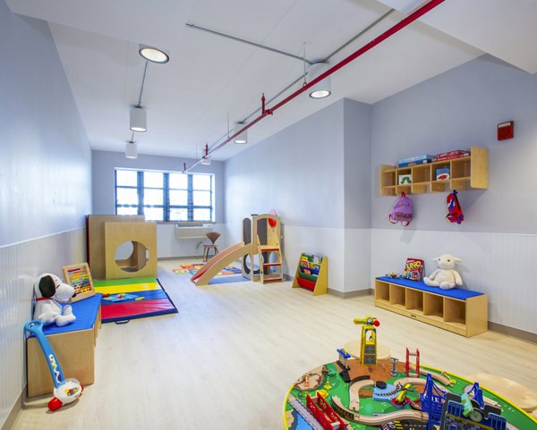 Clubhouse featuring modern design and communal seating at Embankment House Apartments