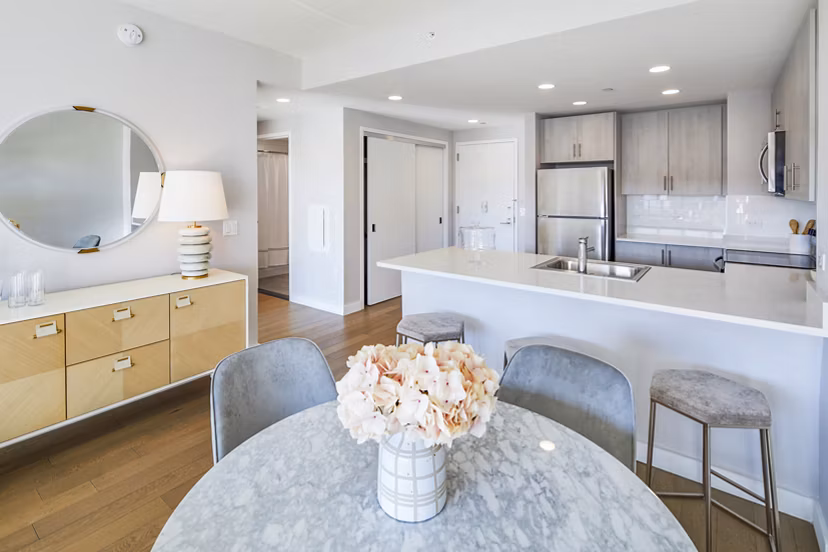 Elegant dining room with modern furnishings at Embankment House Apartments