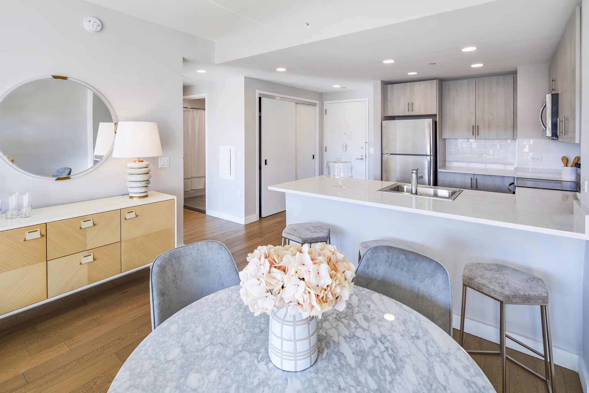 Elegant dining room with modern furnishings at Embankment House Apartments