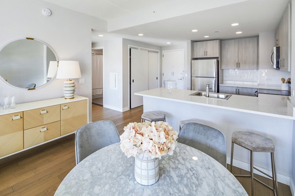 Elegant dining room with modern furnishings at Embankment House Apartments