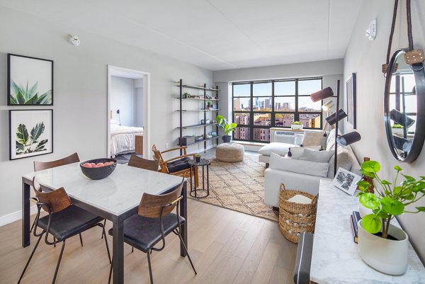 Dining room featuring modern decor and elegant lighting at Embankment House Apartments