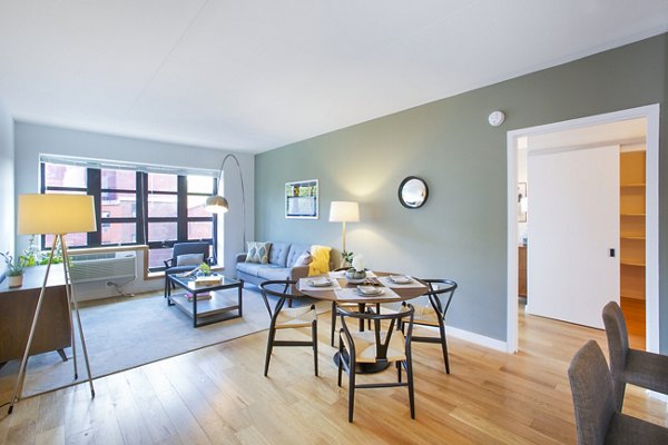 Dining room with contemporary furnishings at Embankment House Apartments, featuring elegant lighting and modern decor