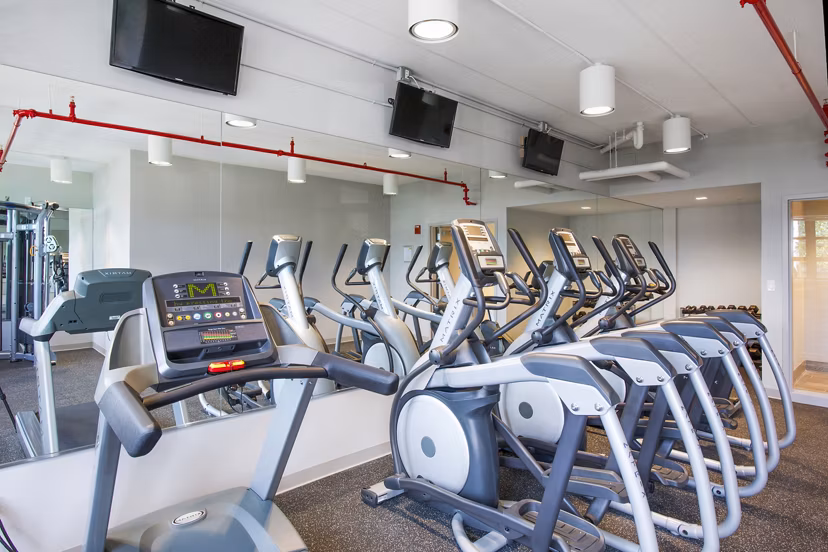 Modern fitness center with top-tier equipment at Embankment House Apartments offering luxury amenities