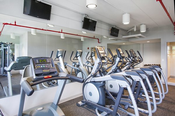 Modern fitness center with top-tier equipment at Embankment House Apartments offering luxury amenities