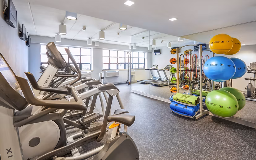 Fitness club with modern equipment at Embankment House Apartments