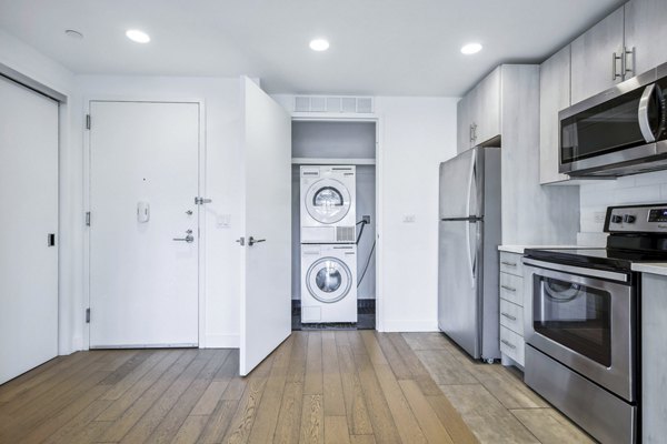 Modern kitchen with stainless steel appliances at Embankment House Apartments; part of Greystar's luxury living portfolio