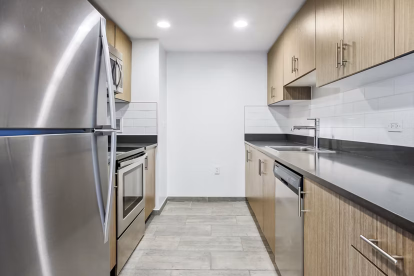 Spacious kitchen with modern appliances in Embankment House Apartments