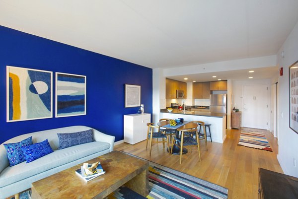 Spacious living room with contemporary furnishings in Embankment House Apartments, showcasing luxurious Greystar living