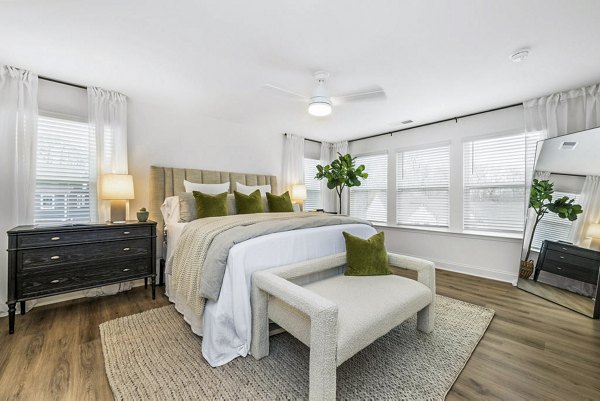 Modern bedroom with sleek furnishings and ample natural light in Affinity at Kendrick Apartments