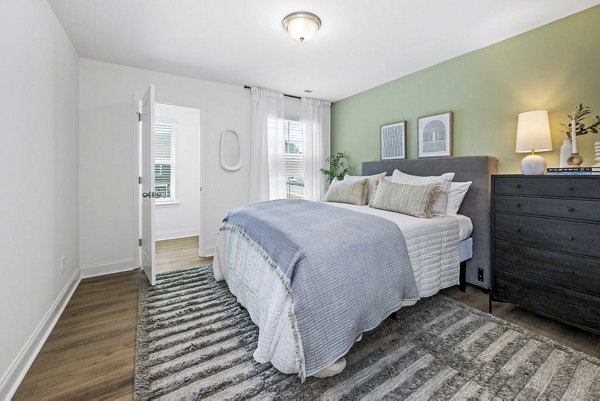 Modern bedroom with stylish decor at Affinity at Kendrick Apartments, a Greystar luxury property
