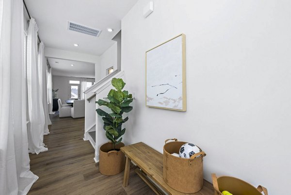Modern living room with chic furnishings and abundant natural light at Affinity at Kendrick Apartments